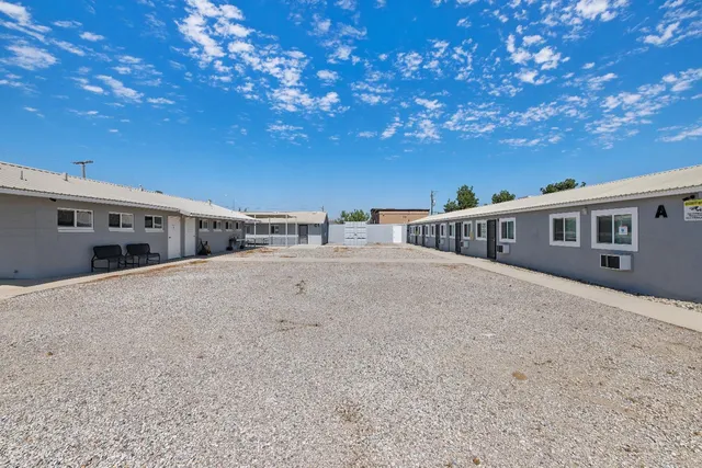 a kitchen with a sink and a stove top oven