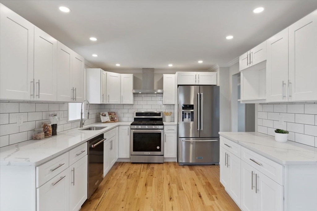 13 Coach North Billerica, MA 01862 - Photo 6 of 41 a kitchen with a sink a refrigerator and a stove top oven