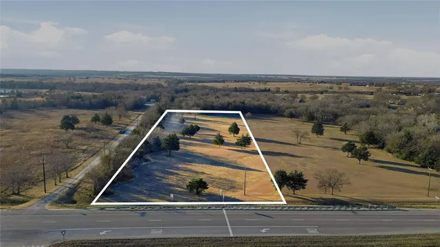 a view of a balcony with wooden floor