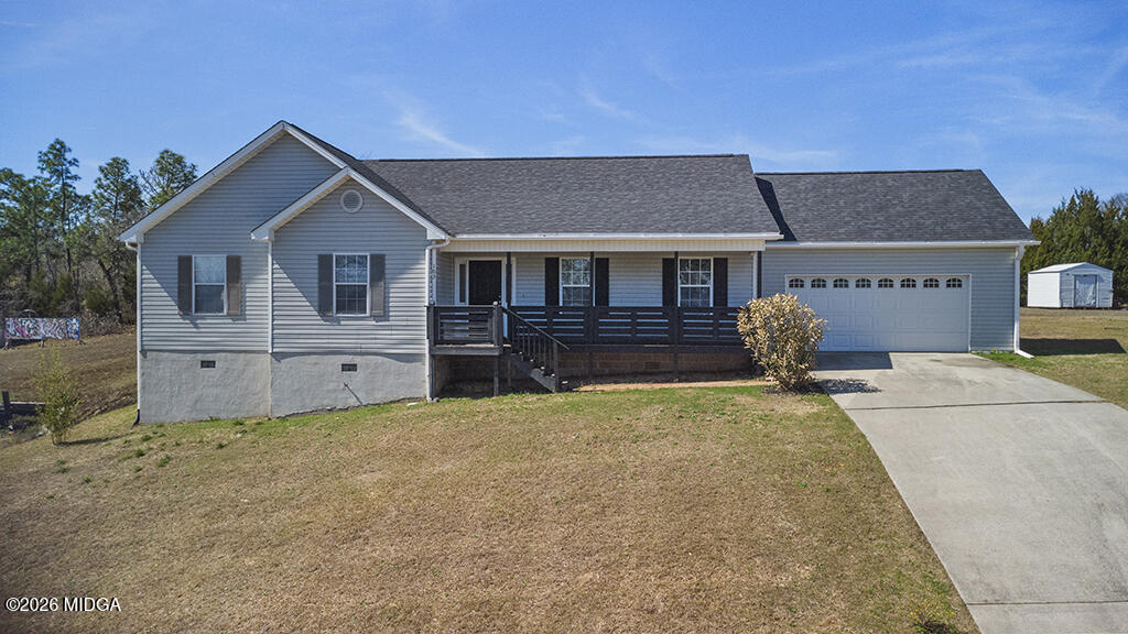 103 Echeconnee Ridge Road Warner Robins, GA 31093 - Photo 1 of 25 a front view of a house with a yard