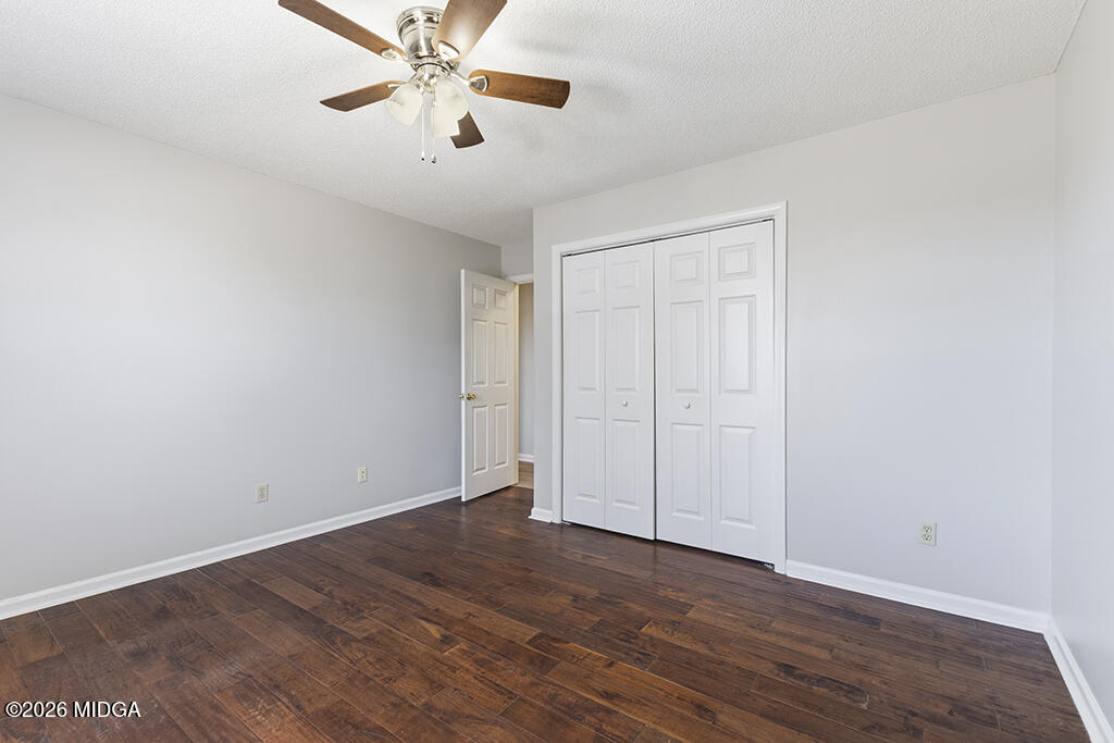 103 Echeconnee Ridge Road Warner Robins, GA 31093 - Photo 18 of 25 a view of an empty room with wooden floor