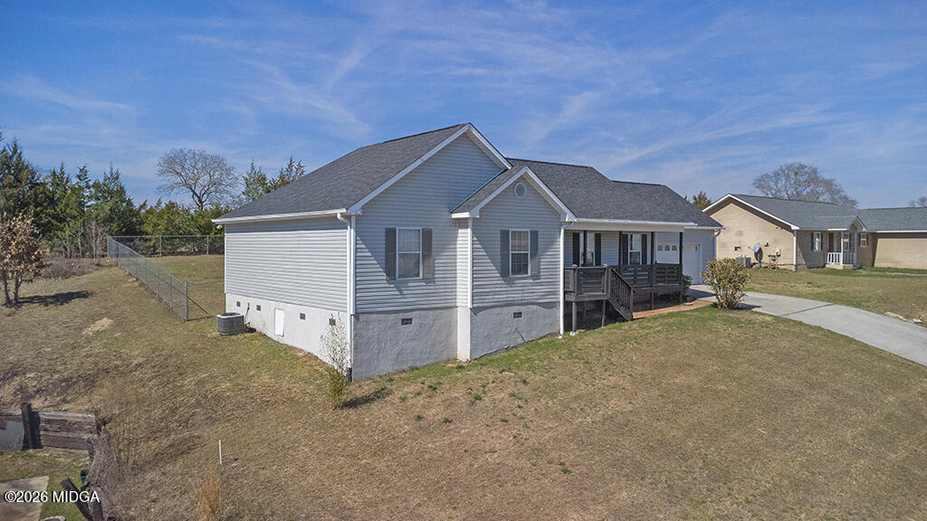 103 Echeconnee Ridge Road Warner Robins, GA 31093 - Photo 3 of 25 a front view of a house with a yard