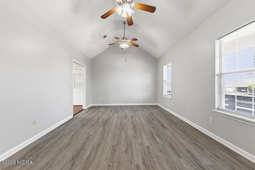 103 Echeconnee Ridge Road Warner Robins, GA 31093 - Photo 9 of 25 wooden floor in an empty room with a window