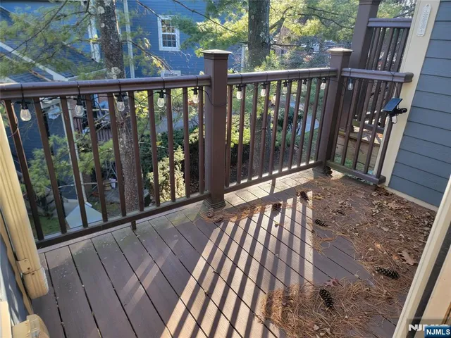 a view of balcony with wooden floor