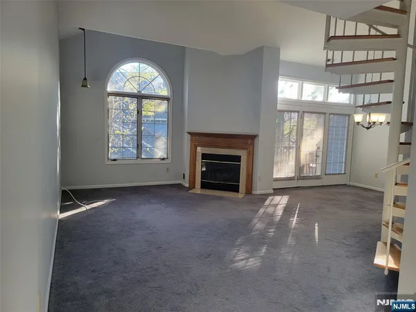 a view of an entryway and livingroom with furniture
