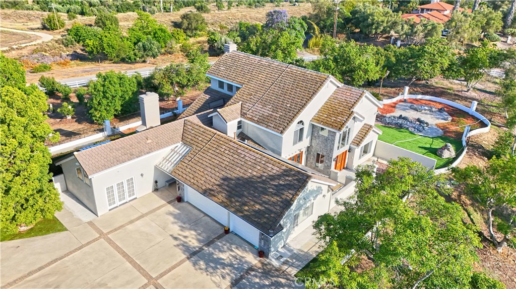 40620 Vía Ranchitos Fallbrook, CA 92028 - Photo 1 of 1 an aerial view of multiple houses with a yard