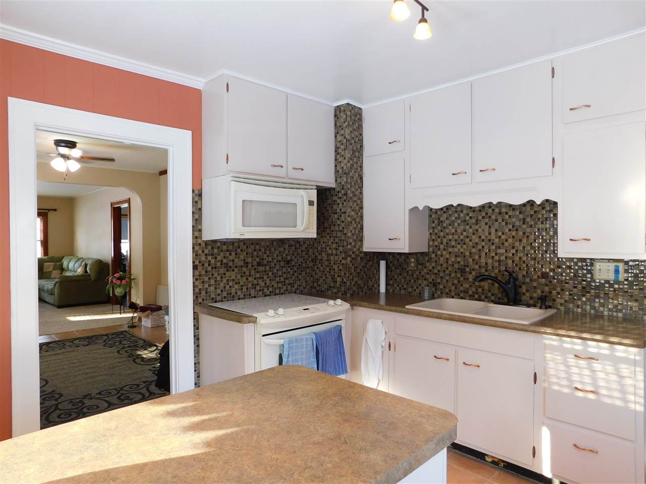 3495 Prairie Road Rockford, IL 61102 - Photo 7 of 23 a kitchen with a sink stove and cabinets
