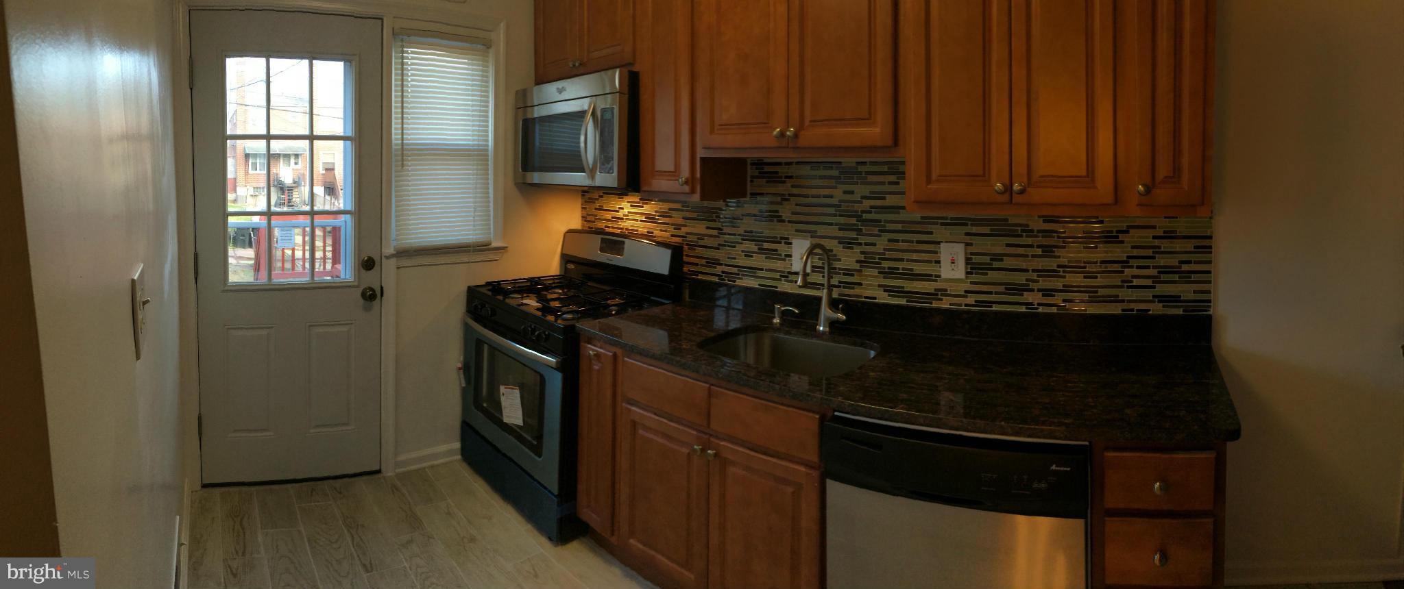4415 Fenor Road Halethorpe, MD 21227 - Photo 12 of 29 a kitchen with a sink and cabinets
