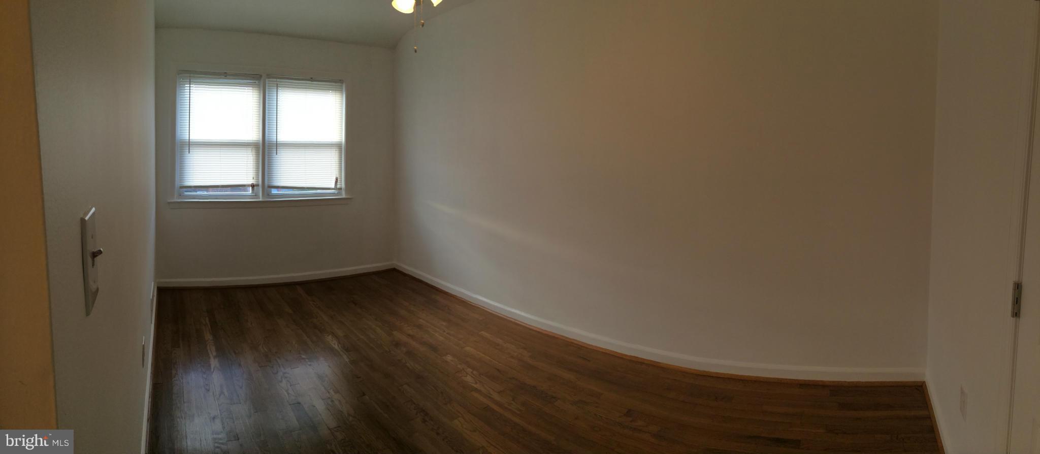 4415 Fenor Road Halethorpe, MD 21227 - Photo 18 of 29 a view of a small space with wooden floor and a window