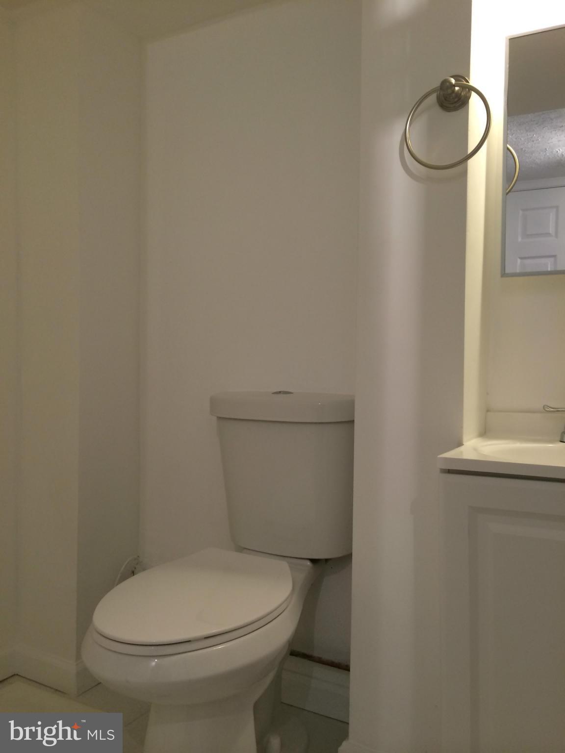 4415 Fenor Road Halethorpe, MD 21227 - Photo 26 of 29 a white toilet sitting next to a white sink