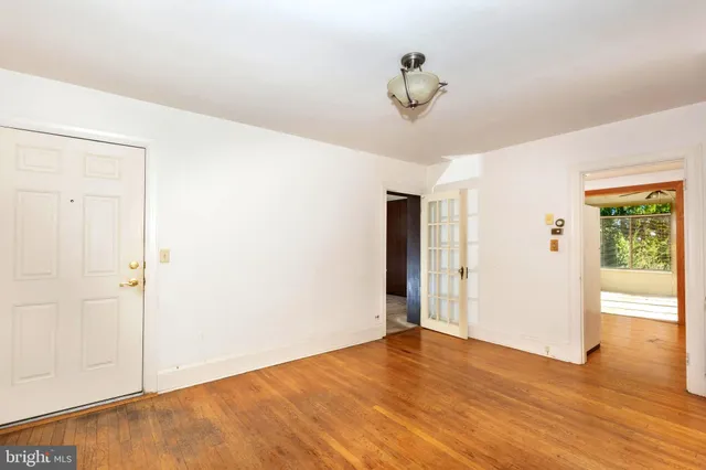 a spacious bathroom with a tub sink and mirror