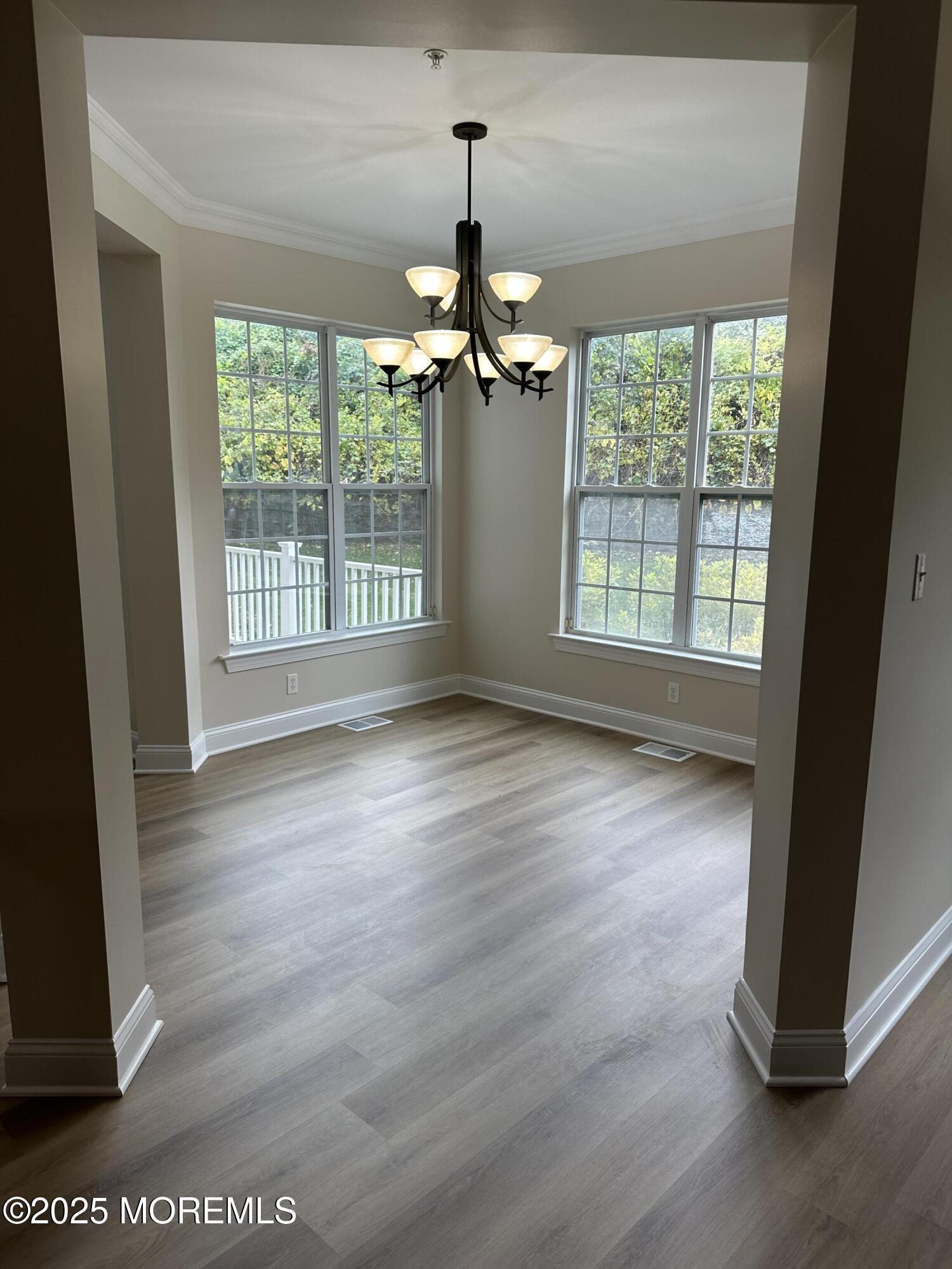 1006 Abby Road Middletown, NJ 07748 - Photo 13 of 36 a view of an empty room with wooden floor and a window