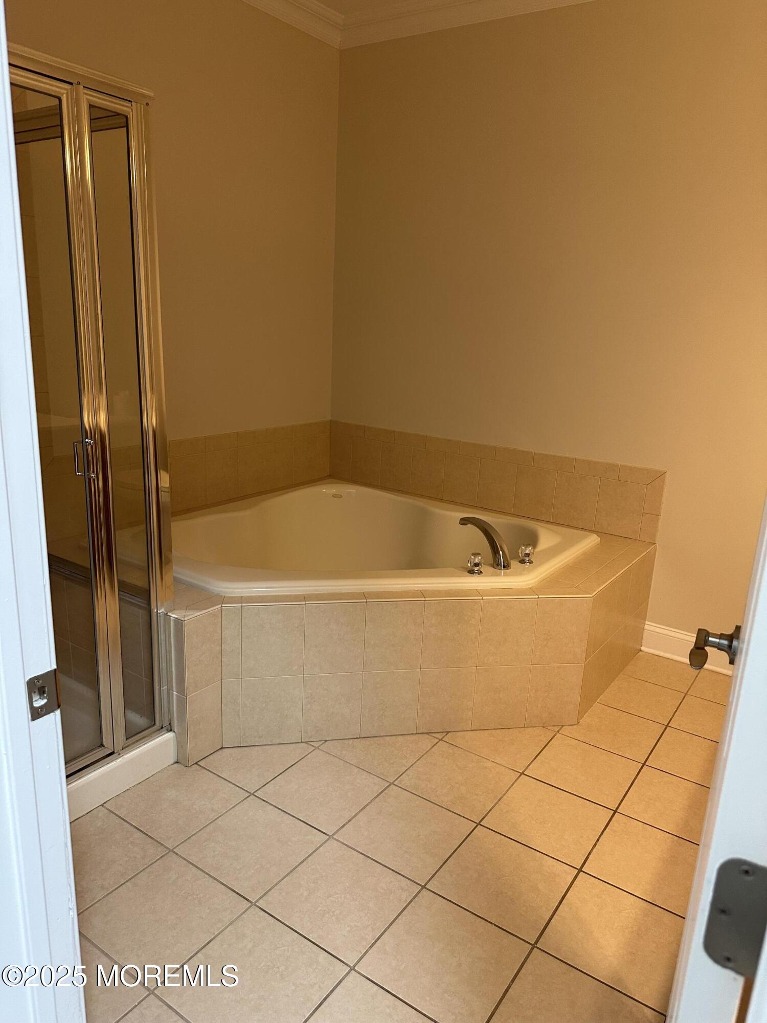 1006 Abby Road Middletown, NJ 07748 - Photo 24 of 36 a white bath tub sitting next to a white wall