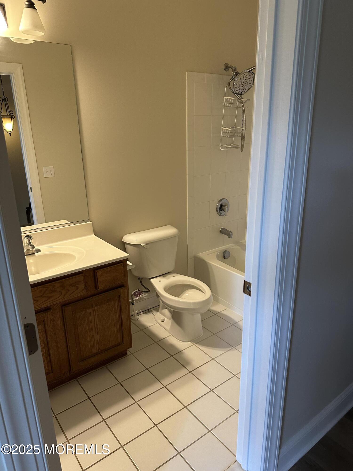 1006 Abby Road Middletown, NJ 07748 - Photo 28 of 36 a bathroom with a sink a toilet and shower