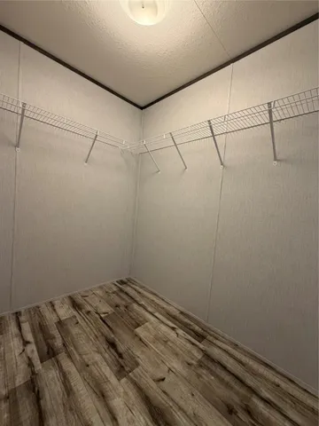 a view of a room with racks on the wall