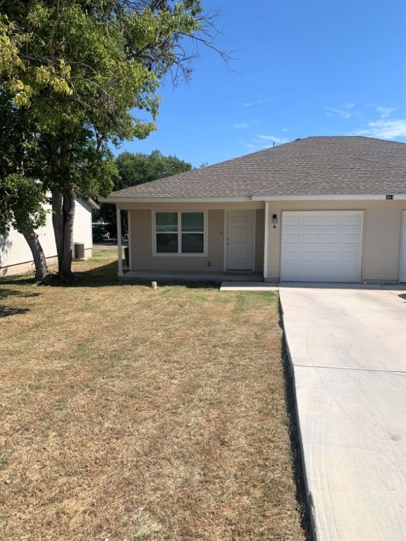 404 Sloan Street, Unit A Taylor, TX 76574 - Photo 1 of 1 front view of a house with a yard