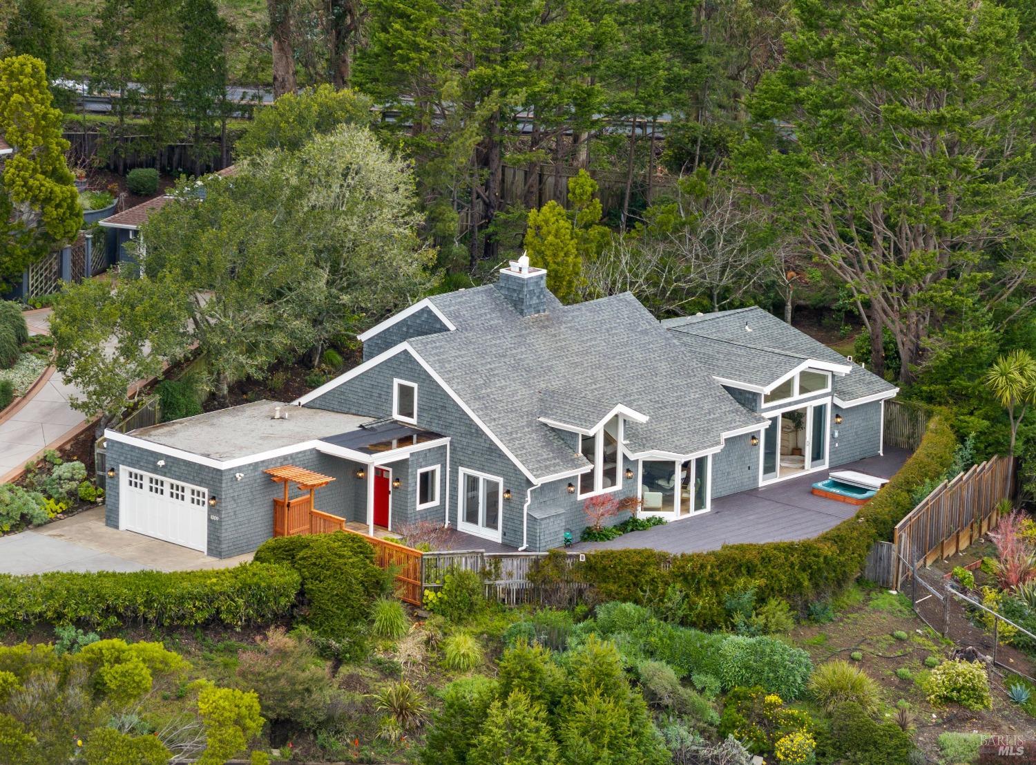 1009 Erica Road Mill Valley, CA 94941 - Photo 1 of 1 an aerial view of a house with balcony and trees al around