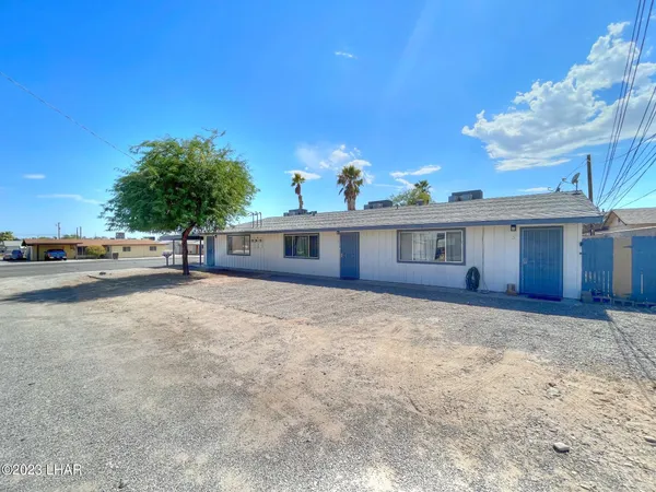 a view of a yard in front of a house