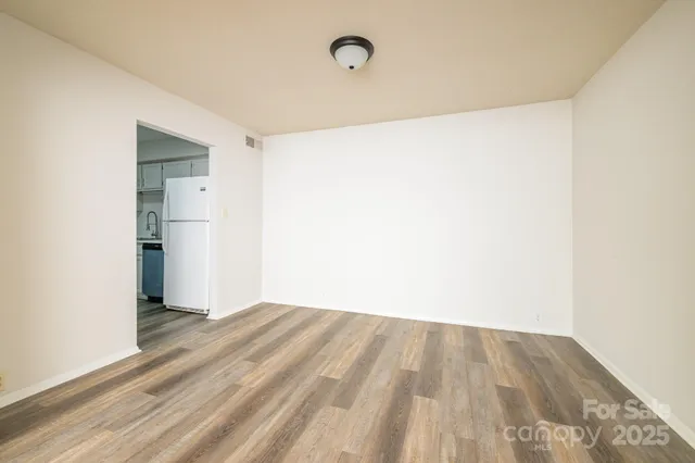 a kitchen with appliances a sink and cabinets