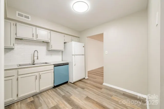 a bathroom with a sink a toilet and bathtub