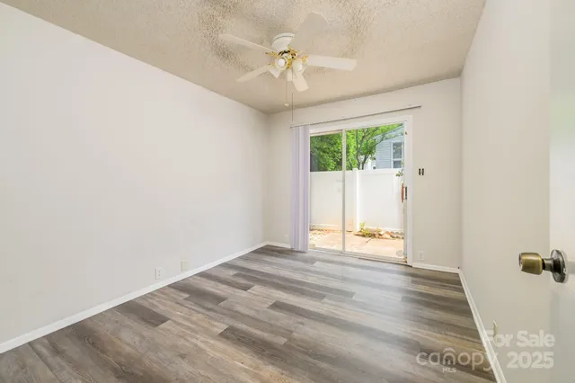 an aerial view of a house with yard