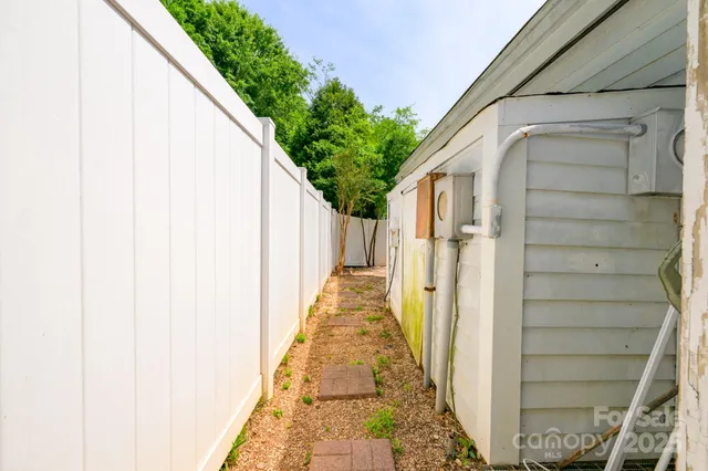 a view of a pathway of a house with wooden floor