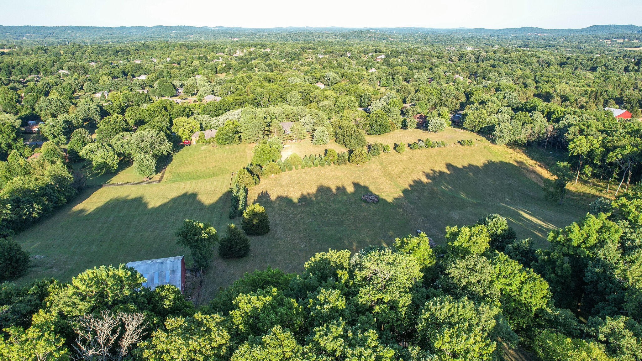 4248 Warren Road Franklin, TN 37067 - Photo 68 of 69 an aerial view of residential houses with outdoor space and trees all around