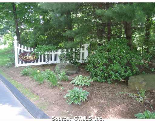 30 Canterbury Road, Unit 30 Hamden, CT 06514 - Photo 1 of 1 a green field with trees in the background