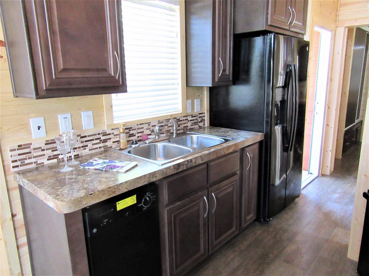 793 22 Road, Unit 67 Grand Junction, CO 81505 - Photo 5 of 14 a kitchen with stainless steel appliances granite countertop a sink stove and refrigerator