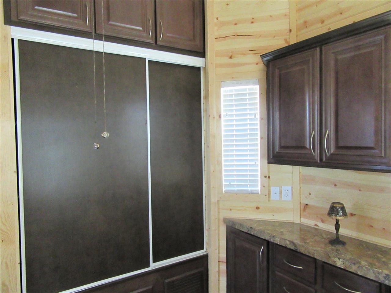 793 22 Road, Unit 67 Grand Junction, CO 81505 - Photo 10 of 14 a bathroom with a granite countertop sink and mirror