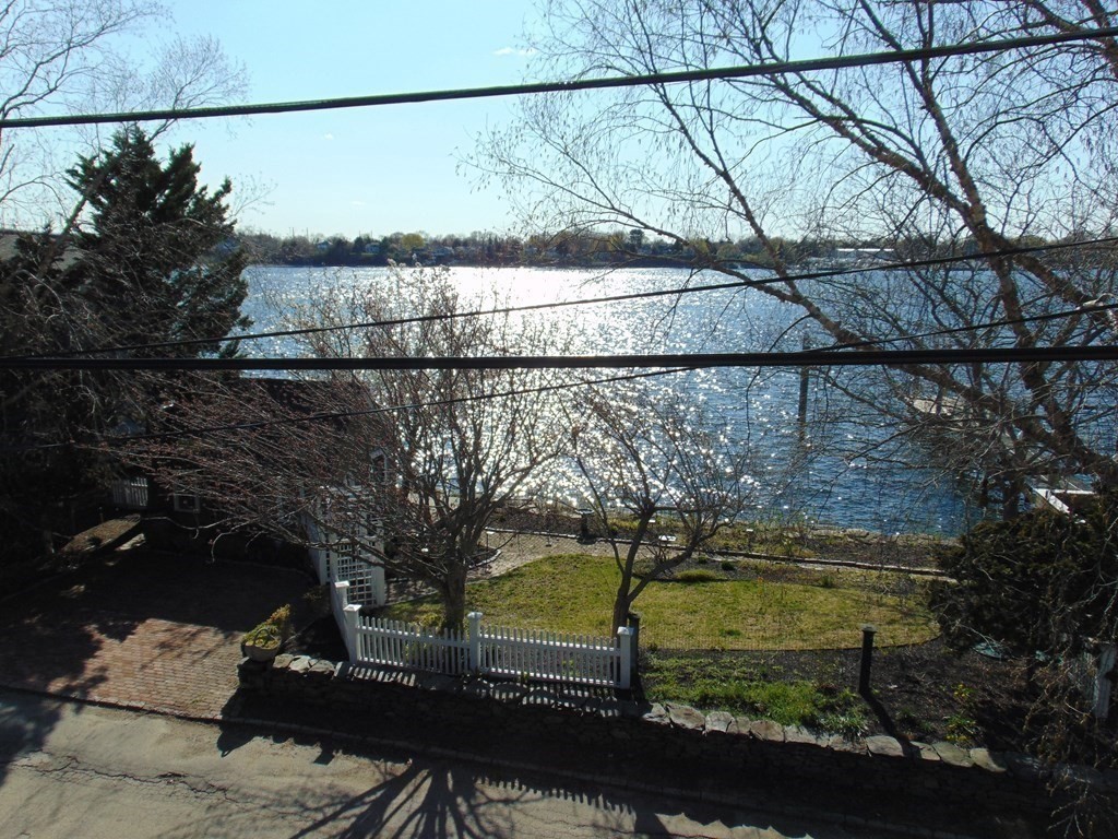 286 Riverside Drive Tiverton, RI 02878 - Photo 11 of 38 a view of a lake from a balcony
