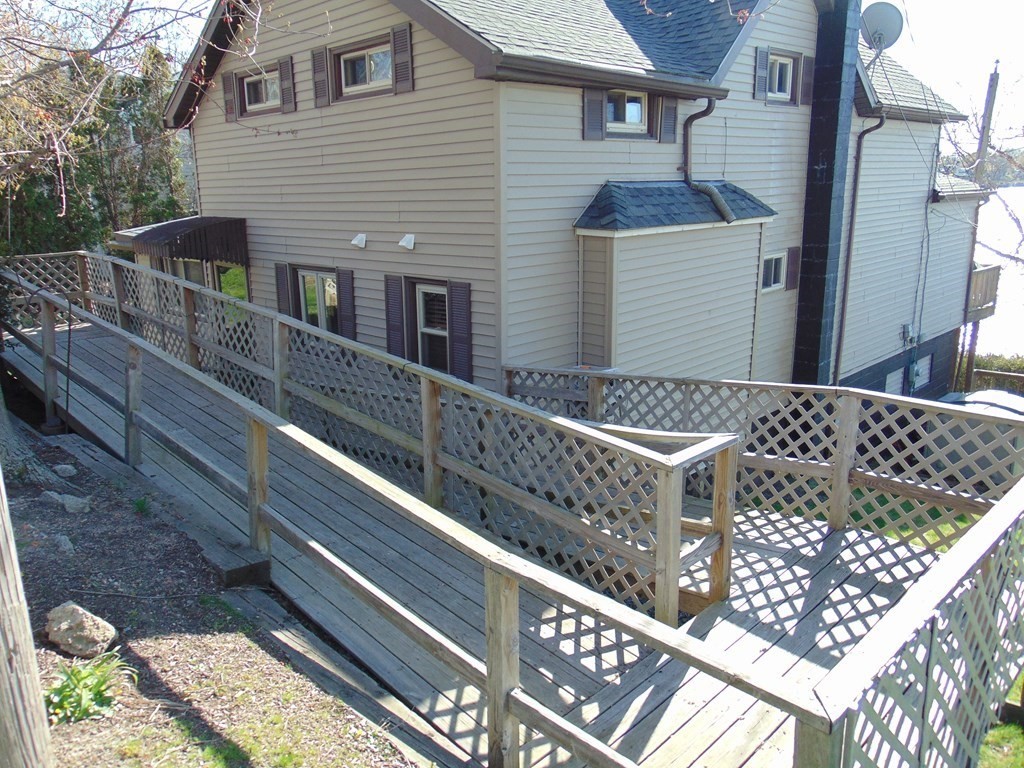 286 Riverside Drive Tiverton, RI 02878 - Photo 15 of 38 a front view of a house with a yard