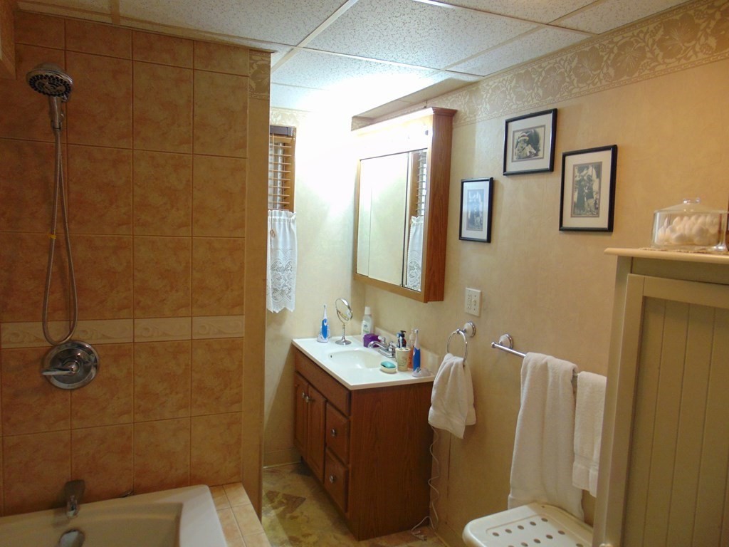 286 Riverside Drive Tiverton, RI 02878 - Photo 22 of 38 a bathroom with a sink mirror and toilet