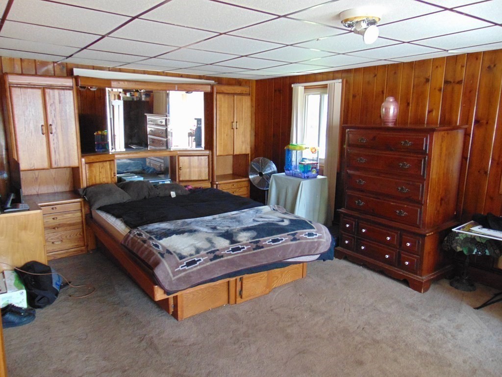 286 Riverside Drive Tiverton, RI 02878 - Photo 23 of 38 a living room with furniture flat screen tv and a window