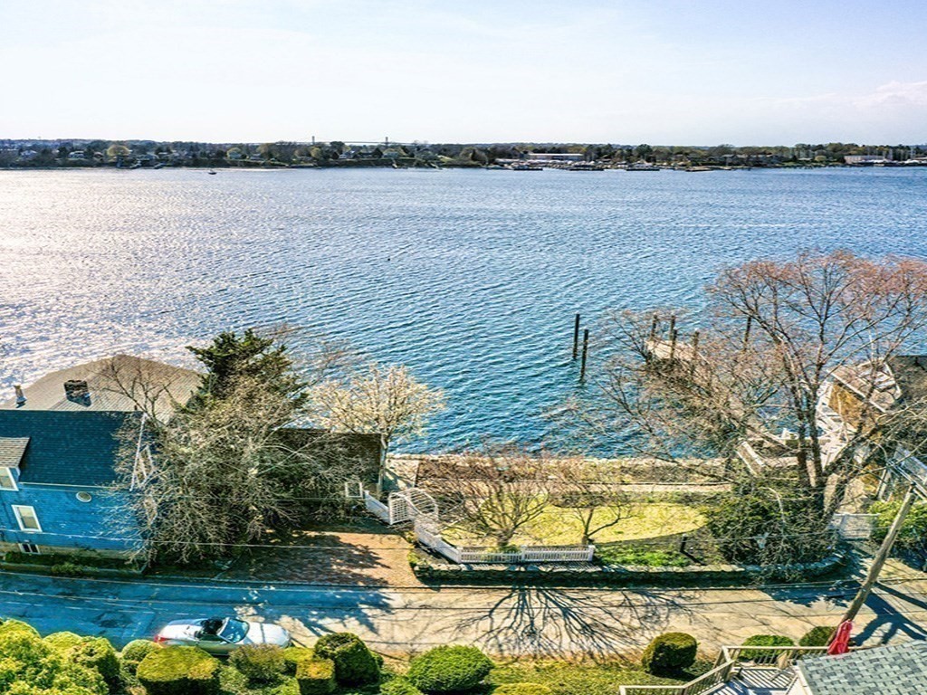 286 Riverside Drive Tiverton, RI 02878 - Photo 8 of 38 a view of a lake from a yard