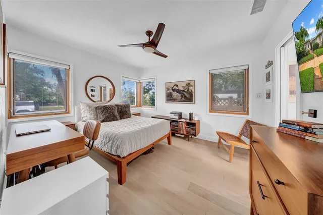 a bathroom with a double vanity sink mirror and shower