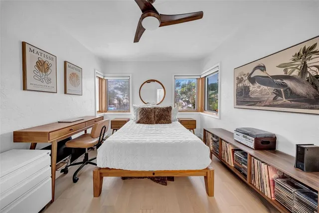 a bathroom with a sink a glass door shower and a mirror