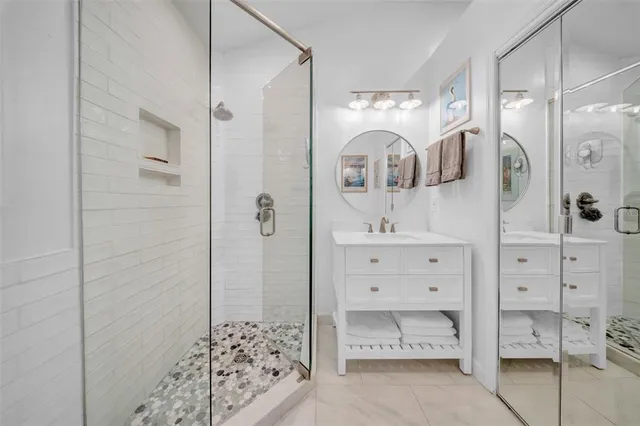 a view of a swimming pool with a patio and a yard