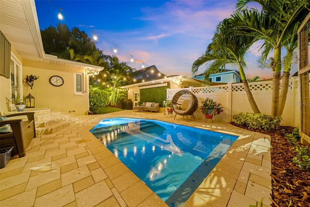 a view of a swimming pool with a patio