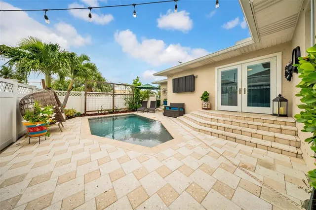 a view of a swimming pool with a patio