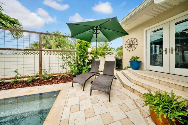 an aerial view of residential houses with outdoor space and river