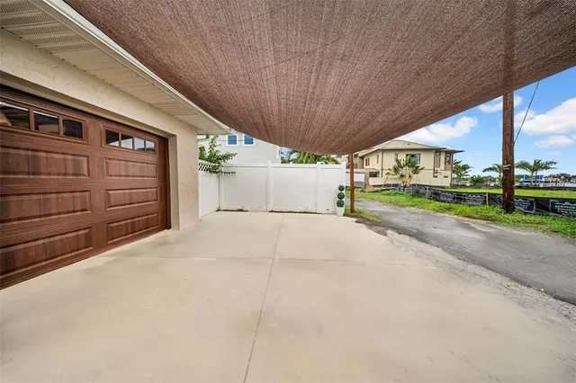 a palm tree sitting in front of a building
