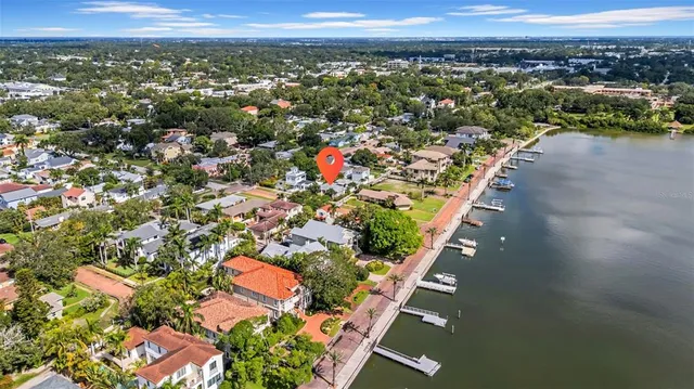 a swimming pool with outdoor seating yard and barbeque oven