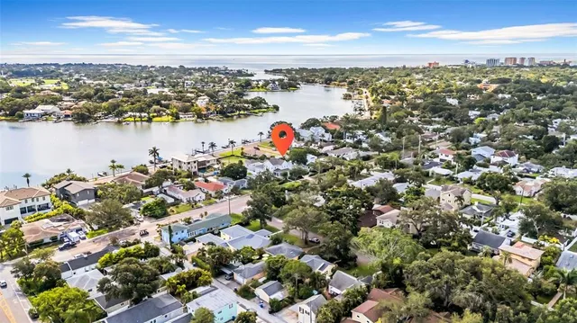 a view of a garden with a building in the background