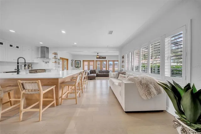 a kitchen with sink and white cabinets