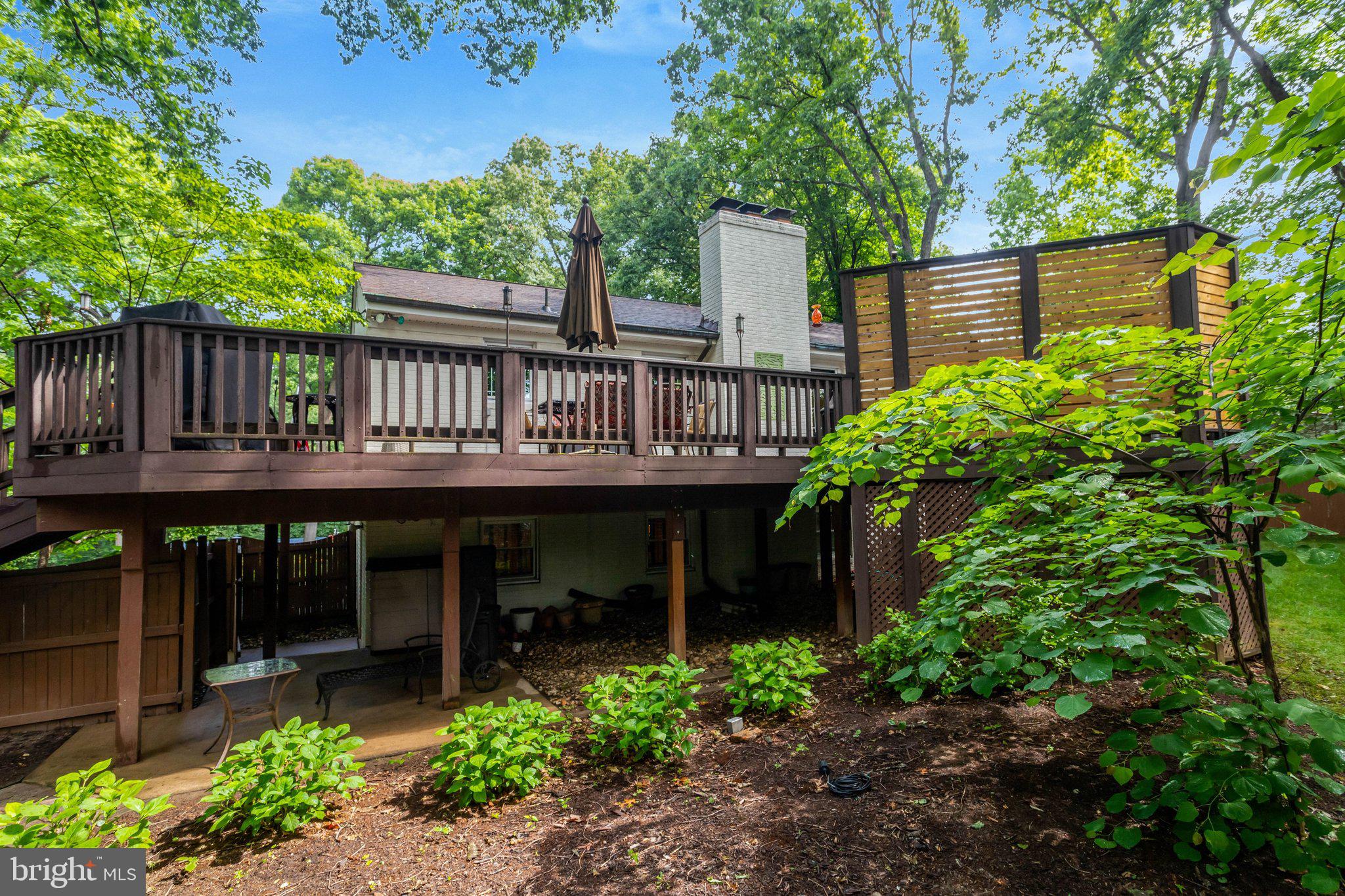 7506 Oriole Avenue Springfield, VA 22150 - Photo 64 of 67 a view of a house with wooden deck and a yard