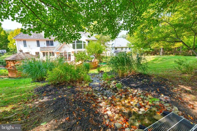 a kitchen with stainless steel appliances granite countertop a stove and cabinets