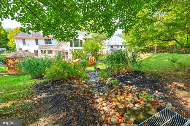 a kitchen with stainless steel appliances granite countertop a stove and cabinets