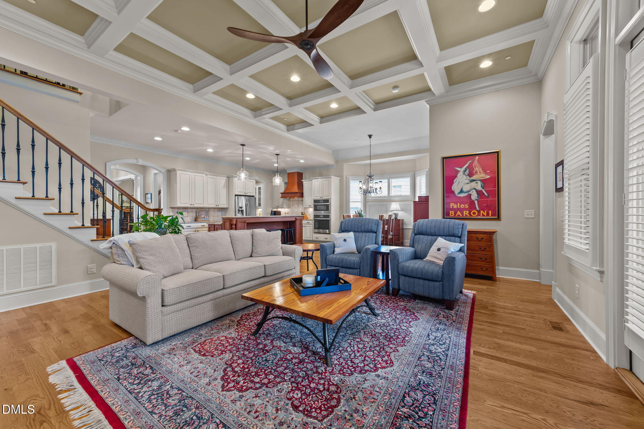 1859 Versa Court Apex, NC 27502 - Photo 12 of 46 a living room with furniture a rug and a chandelier