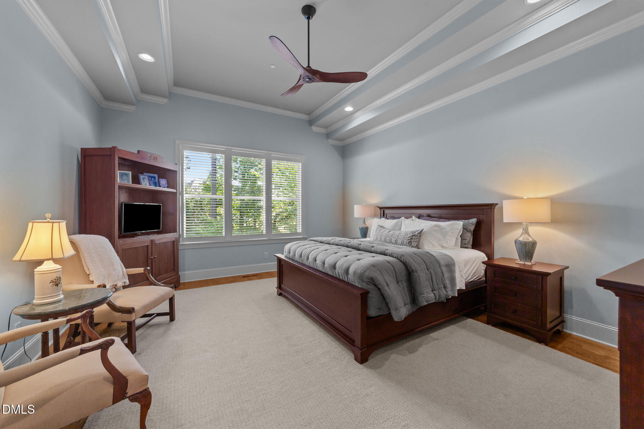 1859 Versa Court Apex, NC 27502 - Photo 13 of 46 a spacious bedroom with a bed and a couch